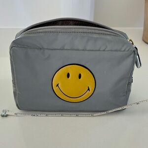 Anya Hindmarch Smiley Face silver grey wash bag